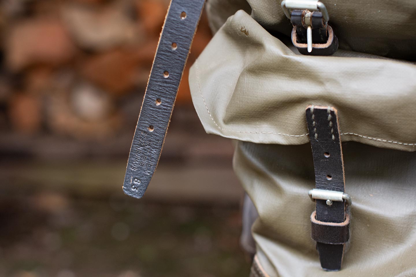Leather rucksack strap with date stamp of 1983